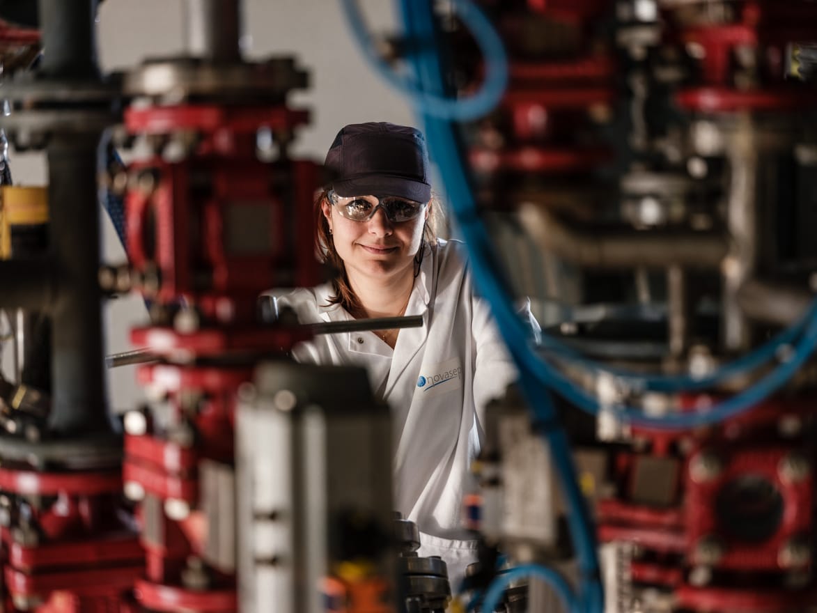 An employee working at Novasep CDMO, part of Axplora